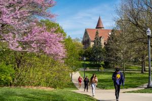 Students walk on campus during the spring.